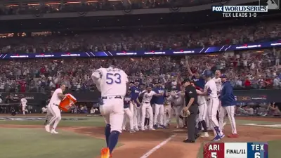Adolis Garcia nears home plate