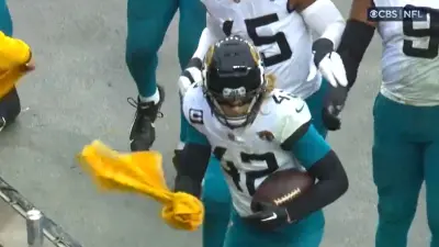 Andrew Wingard holds a towel