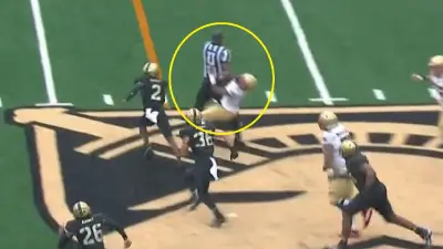 A referee accidentally hitting a Boston College player