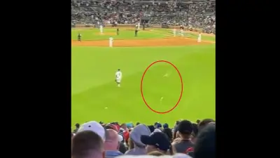 Trash flies onto the field