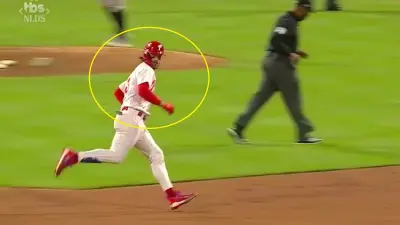 Bryce Harper looks at Orlando Arcia