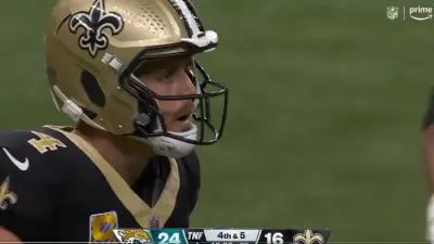 Derek Carr looks at Chris Olave