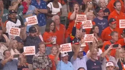 Astros fans holding up 'Free Bryan Abreu' signs