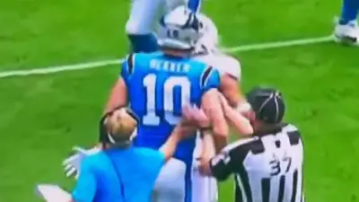 Johnny Hekker headbutting a Dolphins player