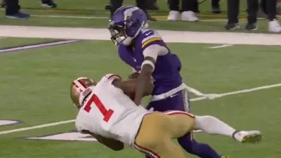 Jordan Addison and Charvarius Ward fighting for a ball