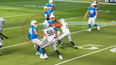 Justin Herbert collides with Maxx Crosby