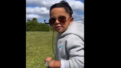 A kid in a Mike McDaniel costume