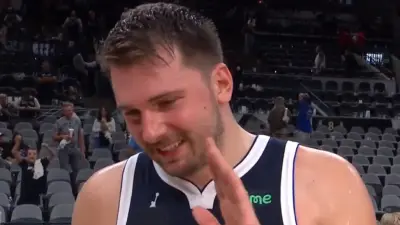Luka Doncic holds up his hand