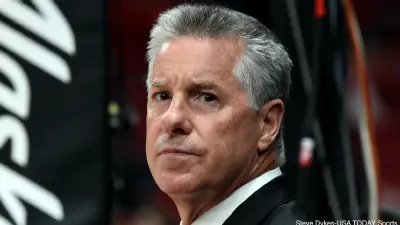 Neil Olshey looking on