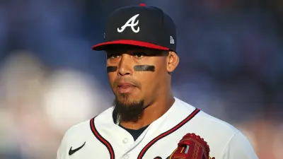 Orlando Arcia wearing a Braves hat