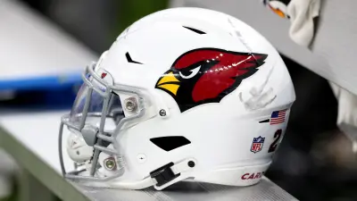 A Cardinals helmet on the bench