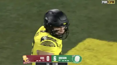 Bo Nix after throwing for a touchdown during an Oregon-USC game
