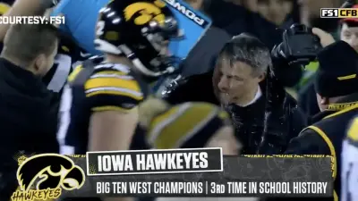 Iowa offensive coordinator Brian Ferentz getting showered with Powerade