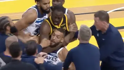 Warriors forward Draymond Green choking Timberwolves center Rudy Gobert