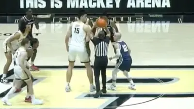 Purdue center Zach Edey jump ball against Samford player Dallas Graziani