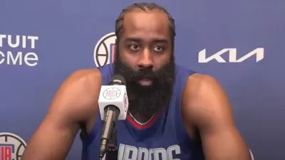 James Harden talks with the media