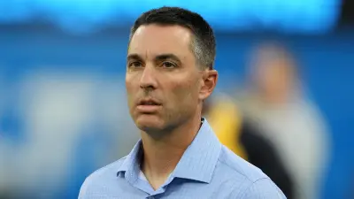 Tom Telesco looking on