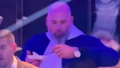 Andrew Whitworth eating in a luxury box