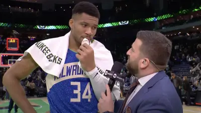 Giannis Antetokounmpo talking to Jared Greenberg after a Bucks win