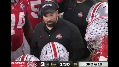 Ryan Day speaking in a Ohio State huddle