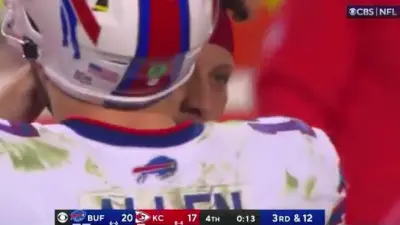 Patrick Mahomes whispering to Josh Allen