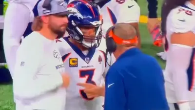 Sean Payton talking to Russell Wilson