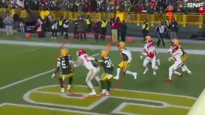 Travis Kelce pushed in the back