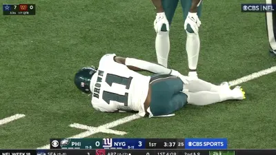 AJ Brown clutches his knee in pain