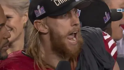 George Kittle gets excited during an interview