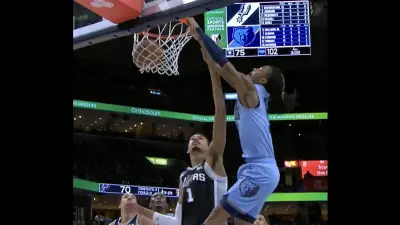 Ja Morant dunks over Victor Wembanyama during Spurs-Grizzlies game