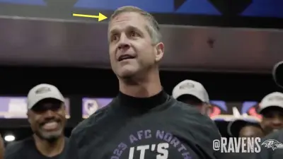 Ravens coach John Harbaugh with blood on his forehead
