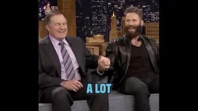 Julian Edelman and Bill Belichick holding hands