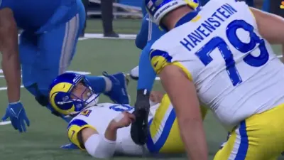 Matthew Stafford hits the ground at Ford Field during Rams-Lions game