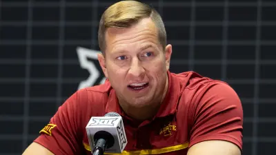 TJ Otzelberger at a press conference