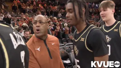 Texas coach Rodney Terry berating UCF players for using "Horns Down" gesture