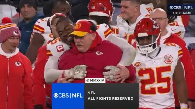 Chris Jones hugs Andy Reid