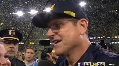 Jim Harbaugh smiles