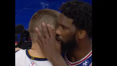 Joel Embiid talks to Nikola Jokic
