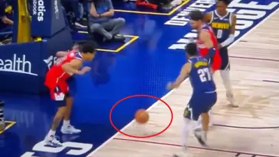 Wizards guard Jordan Poole commits a turnover against the Nuggets