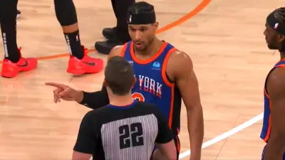 Knicks veteran Josh Hart talking to referee JB DeRosa
