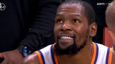 Kevin Durant smiling after Steph Curry's game-winner during Suns-Warriors game