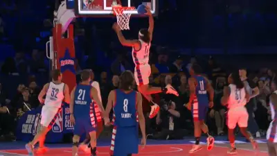 Rams wide receiver Puka Nacua dunks at NBA celebrity game