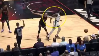 Duncan Robinson and Jaylen Brown tangled up