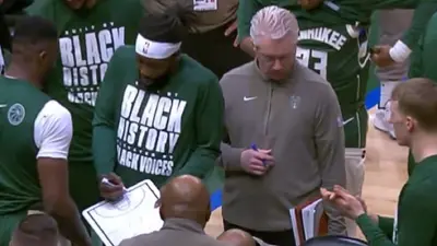 Patrick Beverley holds a clipboard