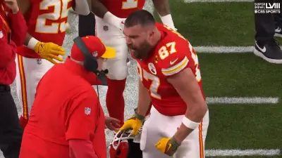 Travis Kelce bumps Andy Reid