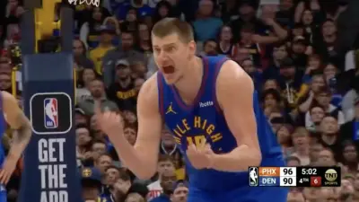 Nikola Jokic screaming at Nuggets head coach Michael Malone