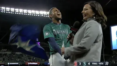 Julio Rodriguez celebrates after a Mariners walk-off hit against Red Sox