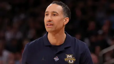 Shaka Smart in a Marquette shirt