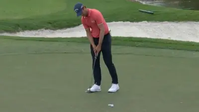 Thomas Detry holds a putter