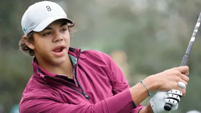 Charlie Woods finishes a swing